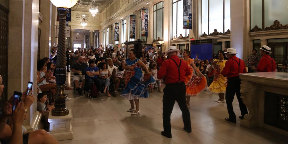 Group of dancers performing at a museum family day. 